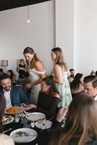 Bride greeting guests during the wedding reception at Union Hall at Bar Marco in Pittsburgh's Strip District — candid documentary moment captured by Pennsylvania wedding photographer Shiloh Leath Photography