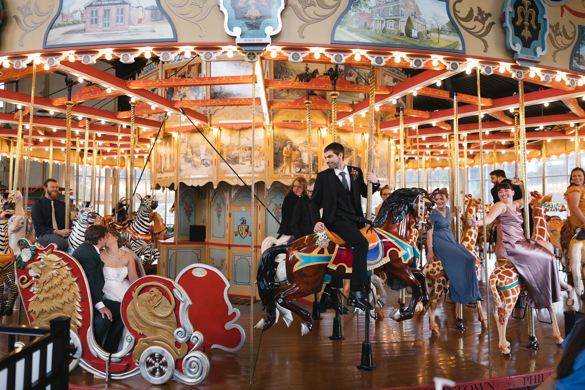Wedding guests ride on a carousel at the Carousel at Pottstown in Pennsylvania