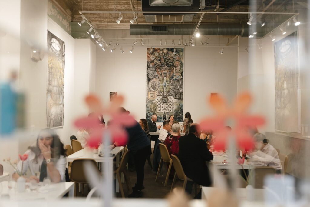 Wedding guests gather for a seated cocktail hour at Frieda in Philadelphia